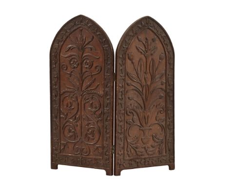 A Victorian carved oak folding fire screen, with arched top.  Height 71 cm, each panel measuring 33 cm.
