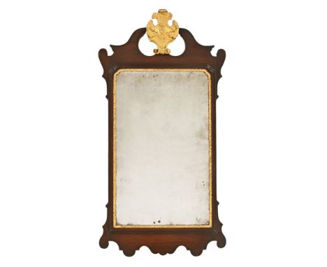 A George III mahogany Chippendale style wall mirror, with gilt painted pediment and slip.  Height 108 cm, width 56.5 cm (see 