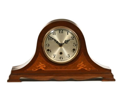 An early 20th century inlaid mahogany mantel clock, with three train spring driven movement and all raised on bracket feet.  