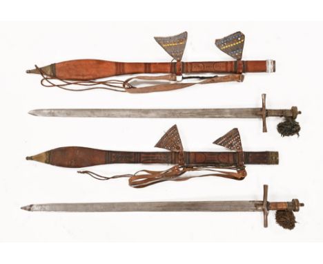 Two vintage Kaskara swords, each in leather scabbard.  Longest 113 cm.  This bladed lot is not for sale to people under the a