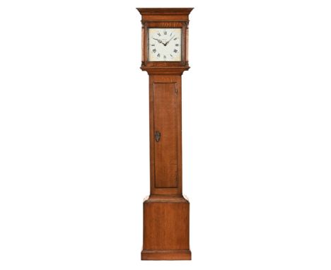 A late Georgian oak longcase clock, with 30 hour movement by Miles Shaston.  Height 219 cm.   CONDITION REPORT:  The dial is 