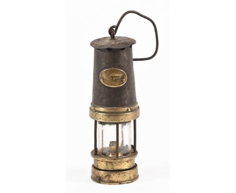 A vintage miners safety lamp, with numbers to body makers mark rubbed.