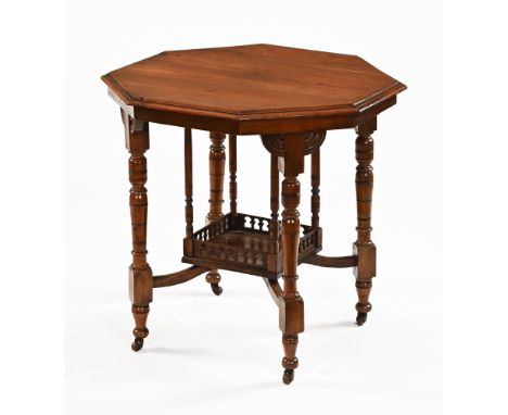 An Edwardian mahogany occasional table, the octagonal top above a lower tier with a square galleried shelf supported by four 