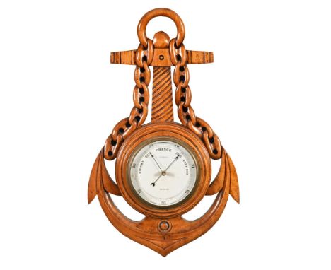 An early 20th century walnut aneroid barometer, by W Carter of Salisbury with nautical case.  Height 43 cm, width 28 cm.