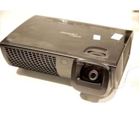 As new in original box Optoma EX525ST projector. This lot will attract VAT at 20% on the sale price. P&amp;P Group 3 (£25+VAT