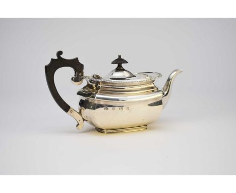 A silver teapot, Elkington &amp; Co, Birmingham 1939, with gadrooned rim and ebony handle and finial, 12cm high, weight appro