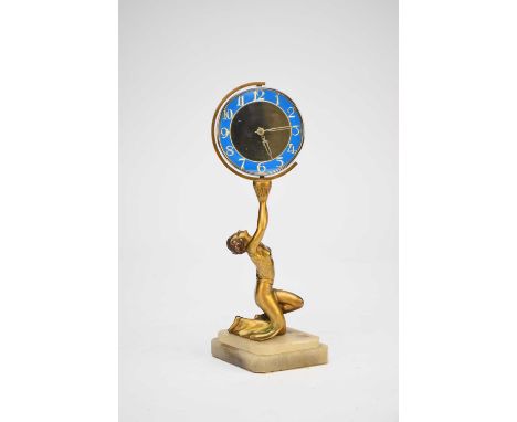 A French Art Deco figural clock, the gilt metal modelled as a kneeling girl in flowing robes, holding aloft a chromium plated