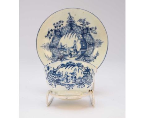 A Worcester 'Mother and Child and Man Fishing' tea bowl and saucer, circa 1780, transfer-printed in underglaze blue, cursive 