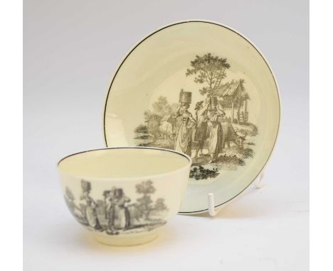A Worcester tea bowl and saucer, circa 1765, transfer-printed in black with the 'Milkmaids' pattern, unmarked, tea bowl 7cm d