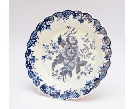 A Worcester 'Pine Cone' pattern dessert plate, circa 1775-80, of scalloped form, transfer-printed in underglaze blue, hatched