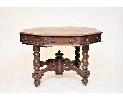 A Victorian oak, octagonal library table, with 4 working drawers, each flanked by a dummy drawer, all with a Gothic style sun
