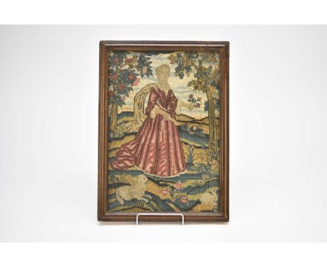 A 17th/18th century needlework panel, depicting a maiden in flowing dress holding a flower spray, she stands in a landscape w