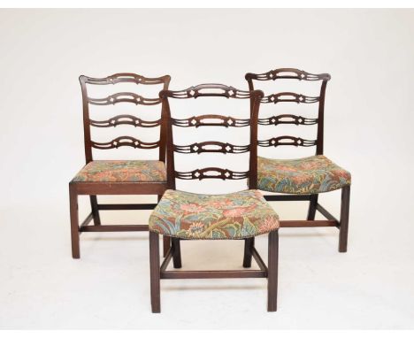A matched set of ten 19th century Chippendale style ladder-back dining chairs, including one carver, eight with stuff-over se