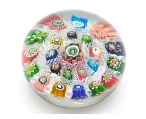 A 19thC. French millefiori paperweight of contrasting colours, some light scratches, 3in diameter x 2.25in