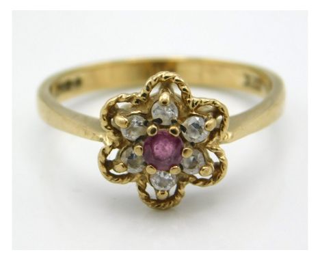 A 9ct gold ring set with diamond &amp; ruby in floral form, size O/P, 2.6g