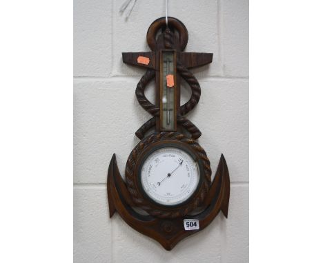 A LATE VICTORIAN WALNUT CASED BAROMETER OF ROPE AND ANCHOR FORM, height approximately 49cm, dial glass loose on floor