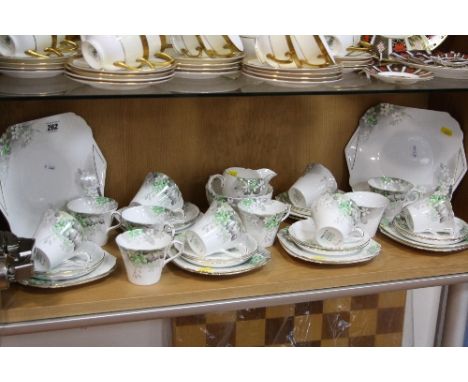 A SHELLEY TEA SET, Perth shape, Reg No 781613, painted SS.0234, green factory mark, to include two cake plates, milk jug (gil