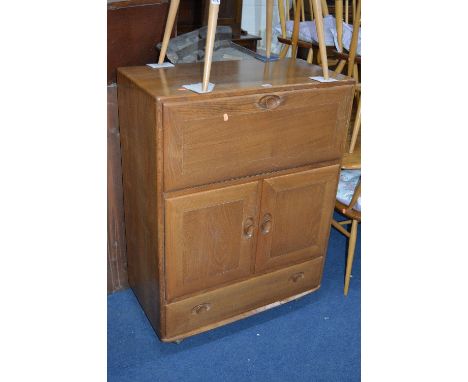 AN ERCOL ELM BUREAU, with fall front over a cupboard and single drawer (sd)