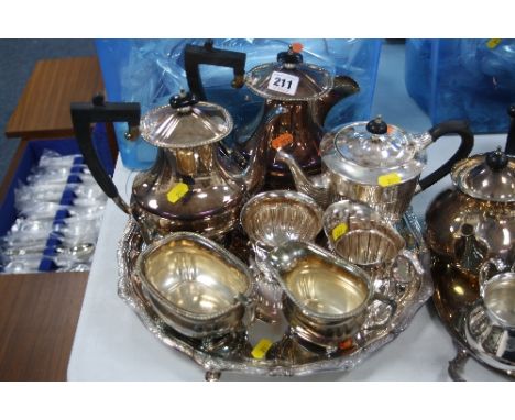 AN ELKINGTON SILVER PLATED FOUR PIECE TEA SERVICE, nine Yeomans plated three piece tea service and a tray