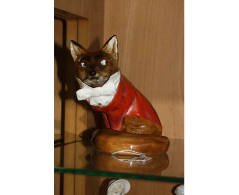 A ROYAL DOULTON FOX, dressed in hunting clothes, HN100, approximate height 15cm (cracks to tail)