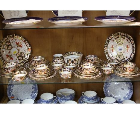 ROYAL CROWN DERBY IMARI TEAWARES, '2451' pattern, to include two cake plates, milk jug, sugar bowl, twelve cups, twelve sauce