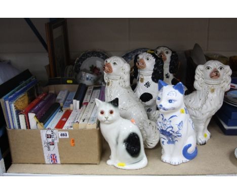 A BOX OF CERAMICS, a box of books, two pairs of seated Staffordshire pottery seated Spaniels and two ceramic cats (two boxes 
