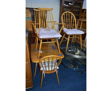 AN ERCOL ELM DROP LEAF TABLE, and four spindle back chairs including two carvers (5)