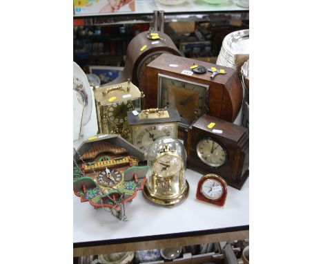 EIGHT VARIOUS CLOCKS AND TIME PIECES including three mantel clocks, cuckoo clock, etc (8)