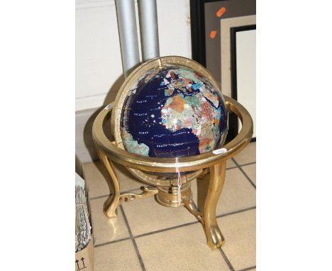 A TABLE TOP SEMI-PRECIOUS STONE INLAID TERRESTRIAL GLOBE OF THE WORLD, raised on gilt metal gimble base with compass, height 