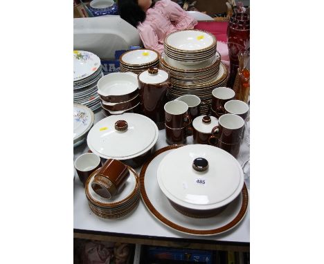 A POOLE POTTERY BROWN AND WHITE GLAZED OVEN TO TABLE DINNER SERVICE, including covered tureens, coffee pot, etc over 70 piece