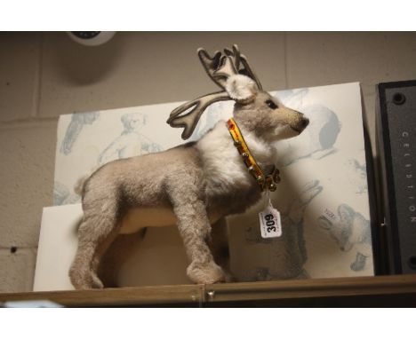 A BOXED STEIFF REINDEER, limited edition No 104 of 1500, complete with certificate, length approximately 30cm, complete with 