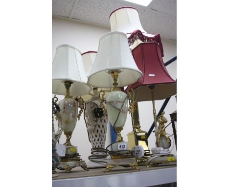 FIVE VARIOUS TABLE LAMPS, to include two similar onyx and gilt lamps, a brass Corinthian column lamp etc, all with shades