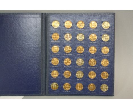 A LIMITED EDITION 1970 ENGLAND WORLD CUP COIN COLLECTION, by The Franklin Mint, thirty in bronze, presented by Esso to give t