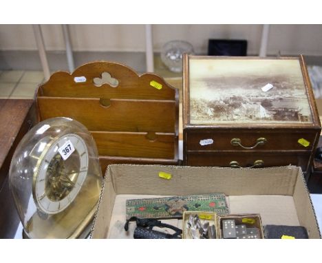 A JUNGHANS ATO BATTERY OPERATED CLOCK, with glass dome, together with letter rack and table top three drawer chest