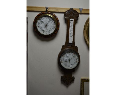 AN OAK ANEROID BAROMETER, and a circular rope edge aneroid barometer (sd) (2)