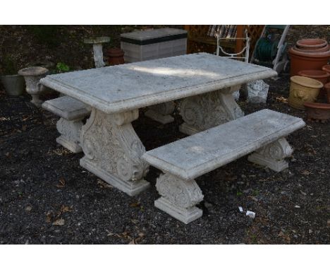 A CONCRETE STYLE GARDEN BENCH, on a pair of supports, approximate size width 191cm x depth 93cm x height 82cm, with a pair of