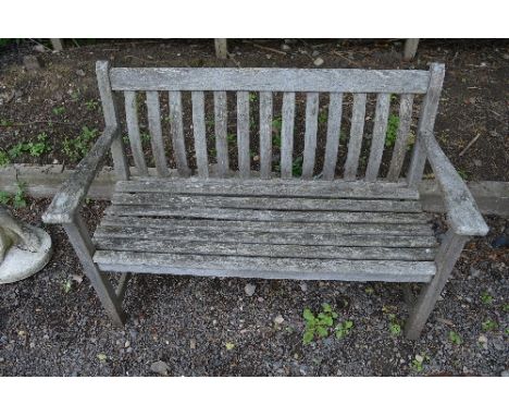 A TEAK GARDEN BENCH, approximate length 127cm