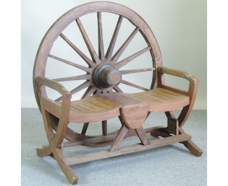 A hardwood garden bench, with a cartwheel back, 120cm