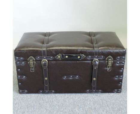 A brown leather upholstered trunk, with a hinged lid, 71cm