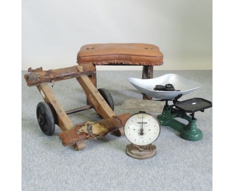 A set of vintage cast iron scales and weights, together with another, a set of vintage wheels and a camel stool
