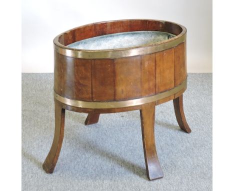 A 19th century coopered mahogany planter, on splayed legs, 70cm