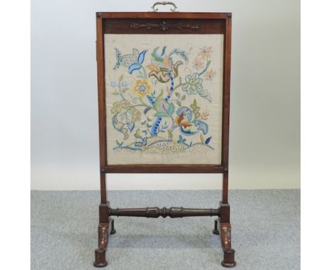 A 19th century carved rosewood fire screen, with a tapestry panel, 54cm