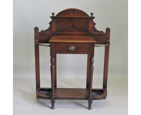 An Edwardian mahogany and brass stick stand, 93cm