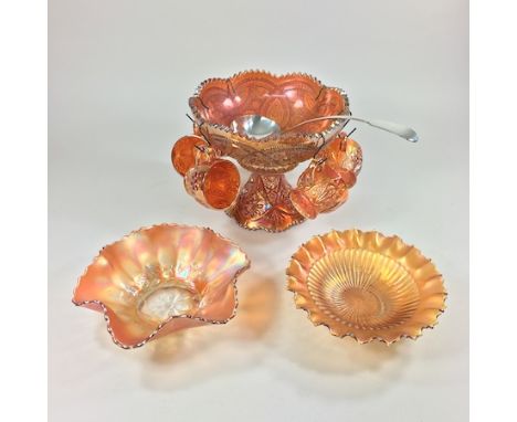 A carnival glass punch set, on stand, together with a silver plated ladle and two carnival glass bowls     