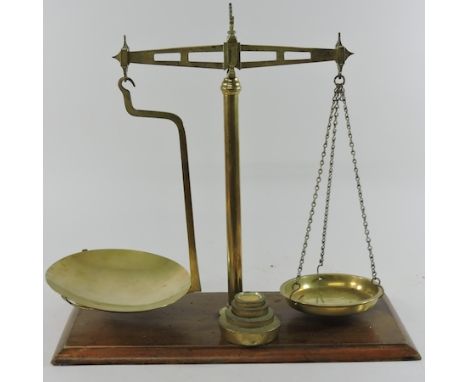 A set of early 20th century brass scales, 50cm, with weights