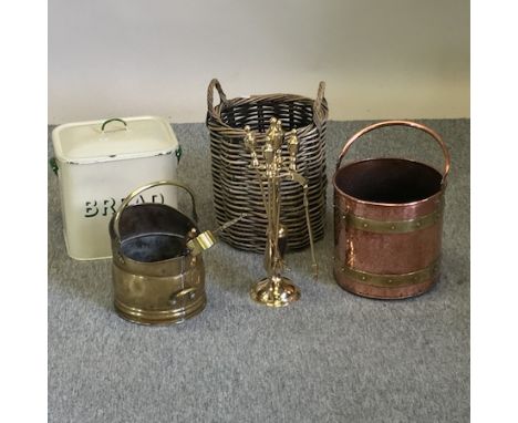 A wicker log basket, 44cm tall overall, together with an enamel bread bin, a 1930's oak brush set, a copper and brass coal bu