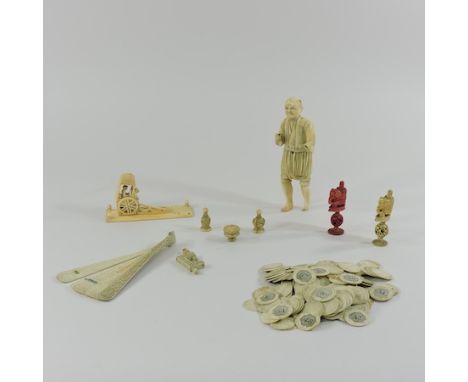 A collection of 19th century ivory items, to include a Japanese figure of a man, 19cm high, together with a Chinese fan, a se