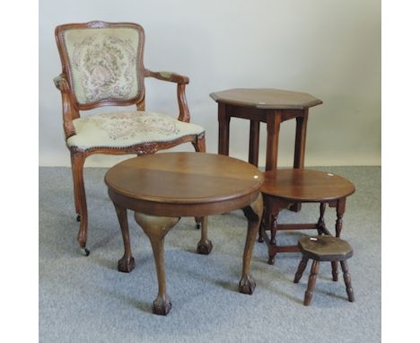 A carved walnut and tapestry upholstered open armchair, together with a circular side table, another, an occasional table and