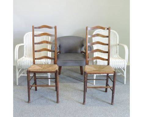 A pair of rush seated ladder back chairs, together with a grey upholstered tub chair and a pair of white painted wicker chair