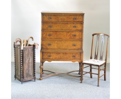 A 1930's walnut chest on stand, 85cm, together with an oak stick stand and contents and an Edwardian inlaid side chair